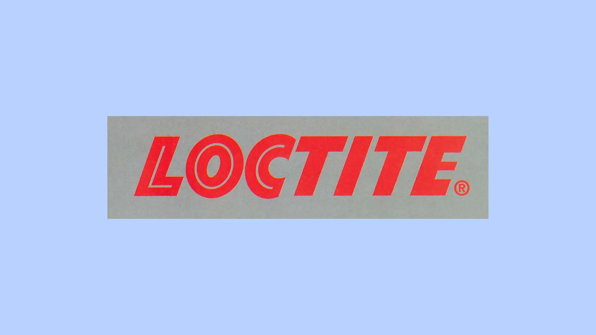 Logotipo vermelho da Loctite sobre fundo cinza.